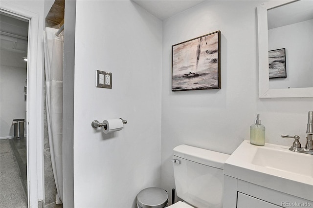 full bath featuring vanity, toilet, and curtained shower