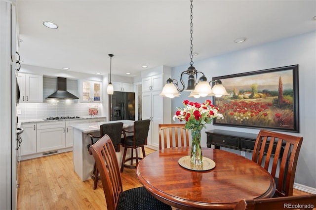 dining space with recessed lighting, visible vents, and light wood finished floors