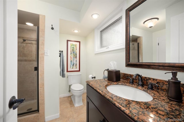 full bath featuring vanity, baseboards, tile patterned flooring, a shower stall, and toilet