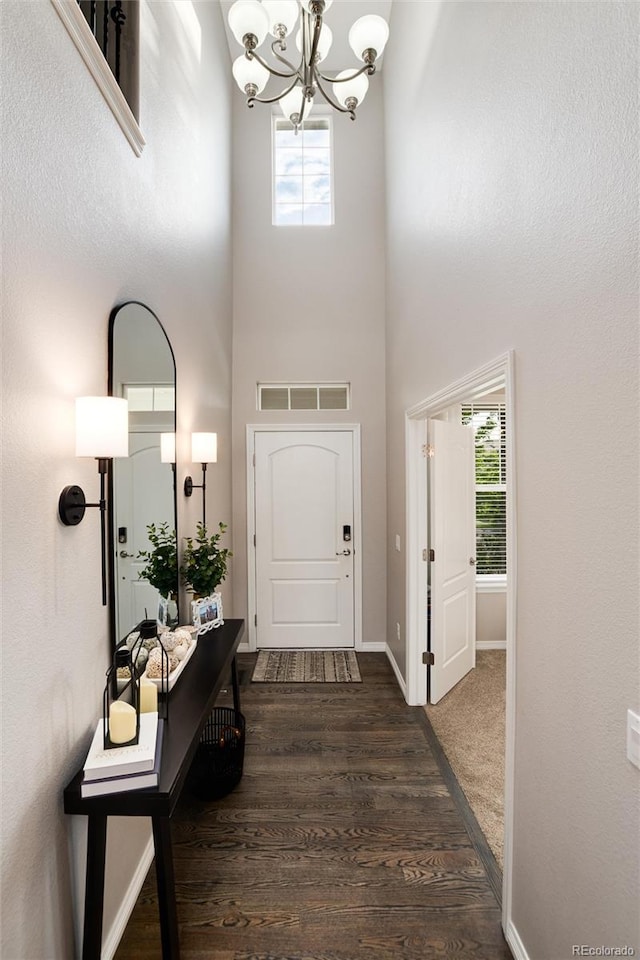 6236 S Millbrook Way, Aurora, CO 80016 - entryway with a towering ceiling, a chandelier, healthy amount of natural light, and wood finished floors
