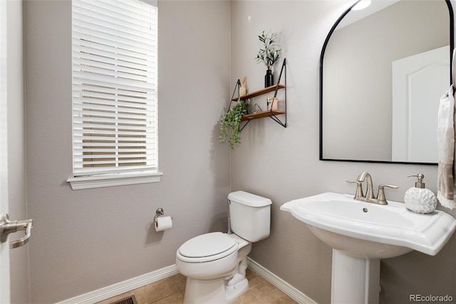 6236 S Millbrook Way, Aurora, CO 80016 - half bathroom featuring baseboards and tile patterned flooring