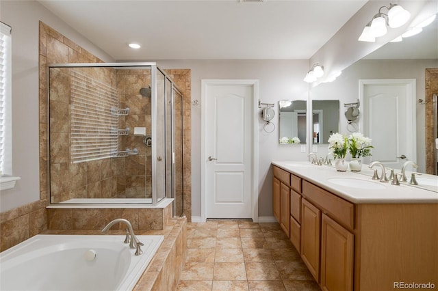 6236 S Millbrook Way, Aurora, CO 80016 - bathroom featuring a bath, double vanity, and a stall shower