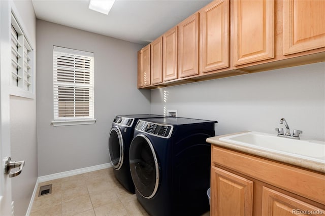 6236 S Millbrook Way, Aurora, CO 80016 - laundry area featuring washing machine and clothes dryer, cabinet space, and light tile patterned floors