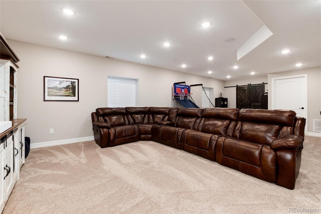 6236 S Millbrook Way, Aurora, CO 80016 - living room featuring light carpet, a barn door, and recessed lighting