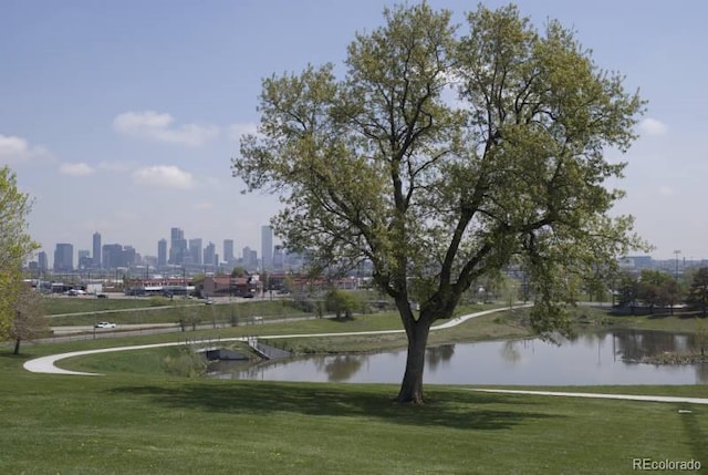 81 N Meade St, Denver, CO 80219 - surrounding community with a yard, a view of skyline, and a water view