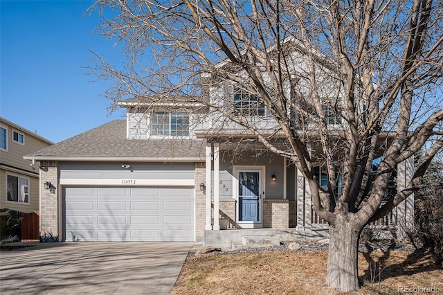 view of front facade featuring concrete driveway, brick siding, roof with shingles, and an attached garage