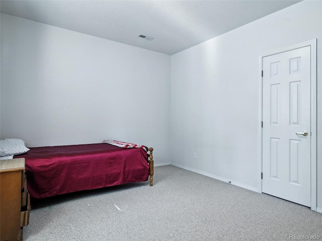carpeted bedroom with baseboards