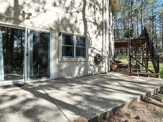 view of patio / terrace featuring stairs