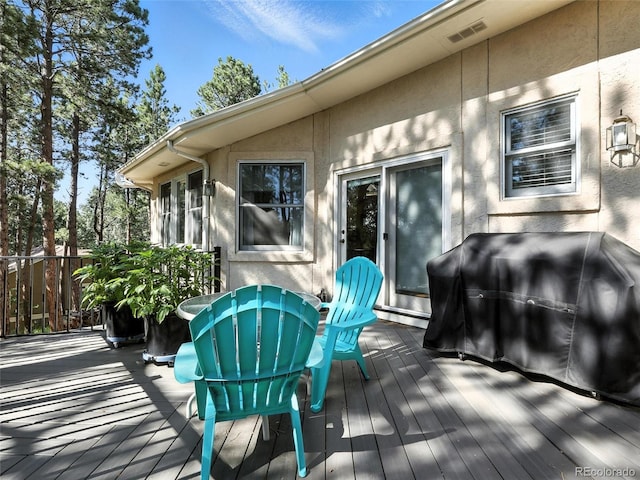 wooden deck featuring grilling area