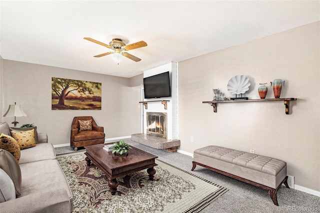 carpeted living room featuring ceiling fan