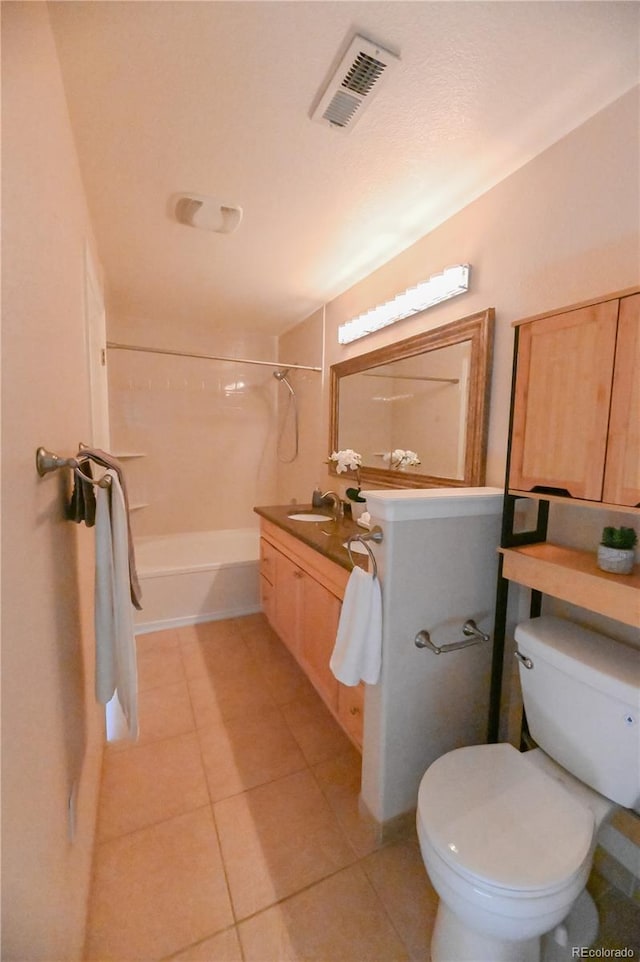 bathroom with tile patterned flooring, toilet, vanity, visible vents, and shower / washtub combination