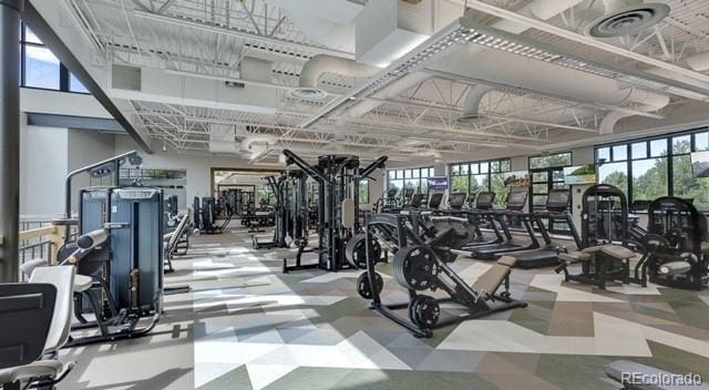 gym featuring visible vents, plenty of natural light, and tile patterned floors