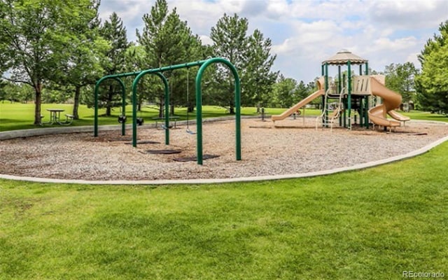 view of playground with a lawn