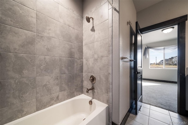 bathroom with tile patterned floors and tiled shower / bath combo