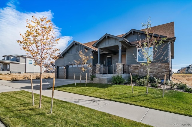 craftsman-style house with a front yard and a garage