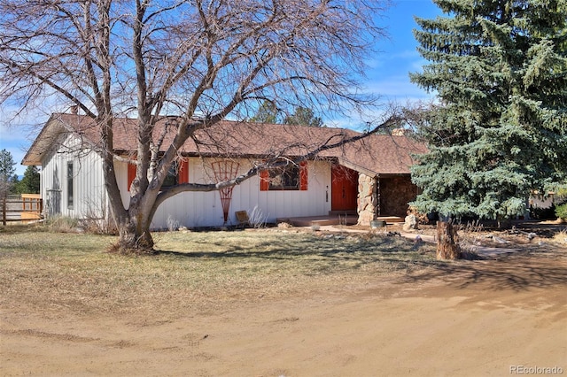 ranch-style house featuring board and batten siding