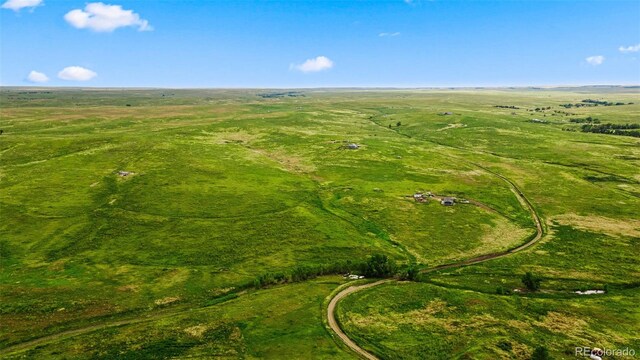 birds eye view of property with a rural view