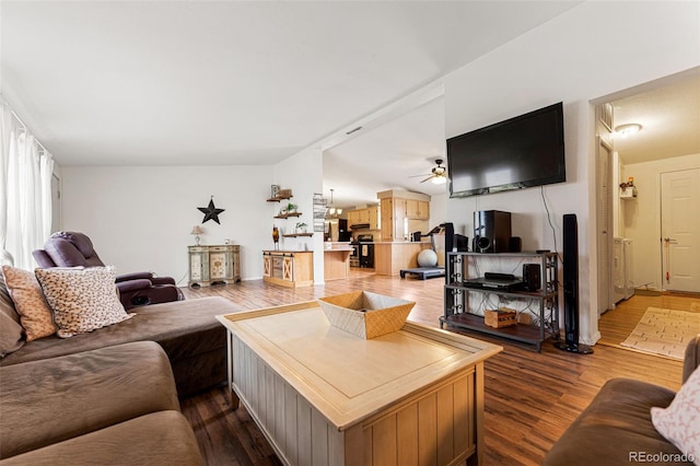 living room with wood-type flooring and ceiling fan