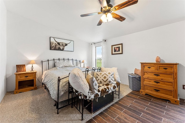 bedroom featuring dark hardwood / wood-style floors and ceiling fan