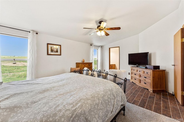 bedroom featuring ceiling fan and vaulted ceiling