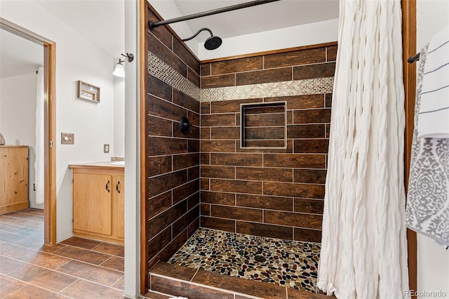 bathroom featuring vanity and a shower with shower curtain