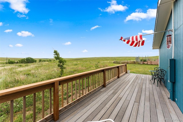 wooden deck with a rural view