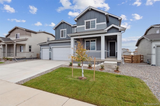 view of front of house featuring a porch, a garage, and a front yard