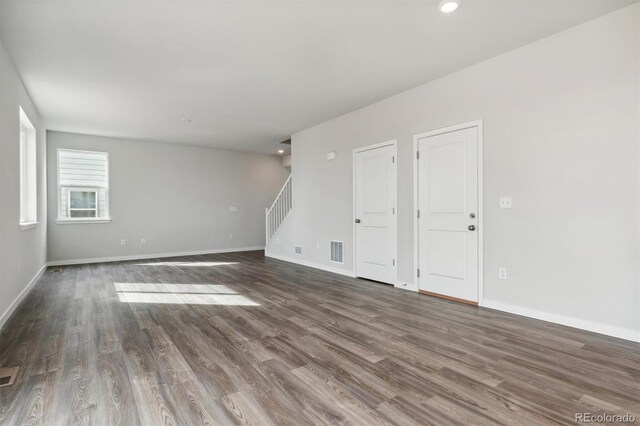 empty room featuring dark hardwood / wood-style flooring