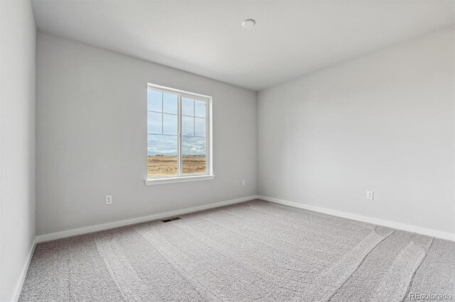 spare room with carpet flooring