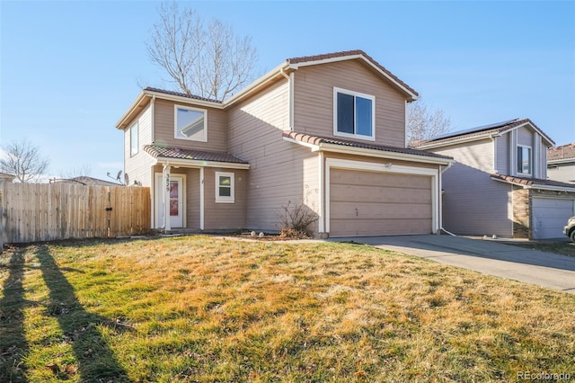 traditional-style home featuring a garage, fence, driveway, a tiled roof, and a front yard