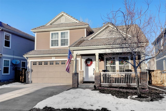 front facade featuring a garage and covered porch