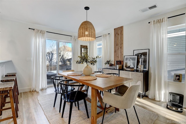 dining room featuring light hardwood / wood-style floors