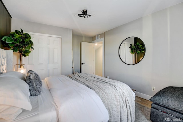 bedroom featuring a closet and hardwood / wood-style floors