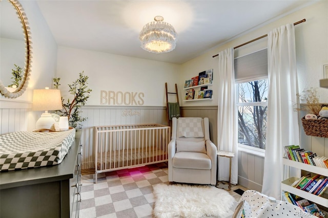 bedroom featuring a crib