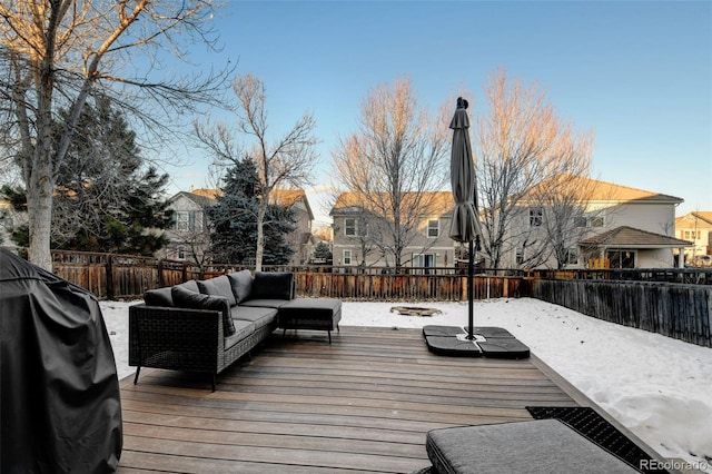 snow covered deck featuring an outdoor hangout area and a grill