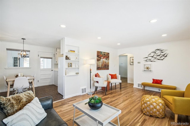 living room with light hardwood / wood-style flooring