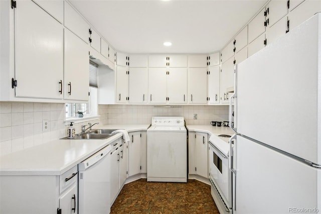 kitchen featuring white cabinetry, white appliances, washer / clothes dryer, and sink