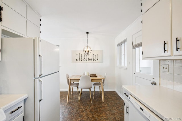 kitchen featuring hanging light fixtures, backsplash, white cabinets, and white appliances