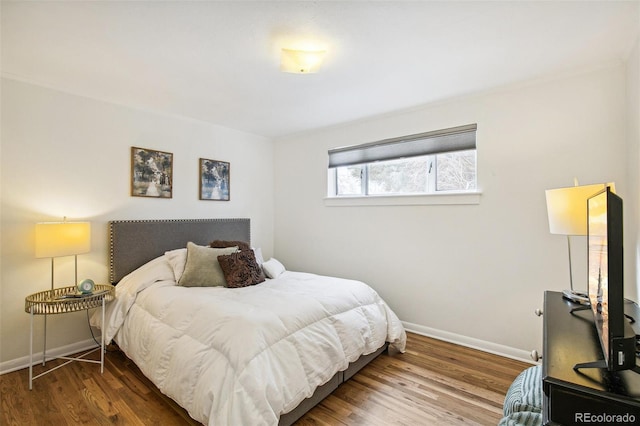 bedroom with wood-type flooring