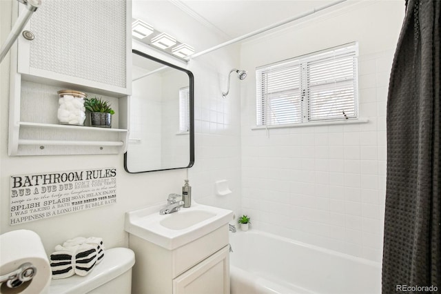 full bathroom with shower / tub combo, vanity, ornamental molding, and toilet