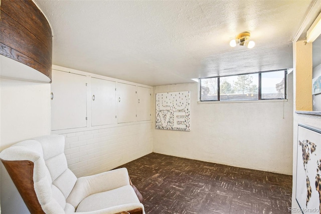 sitting room featuring a textured ceiling