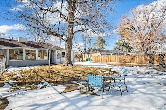 view of yard layered in snow