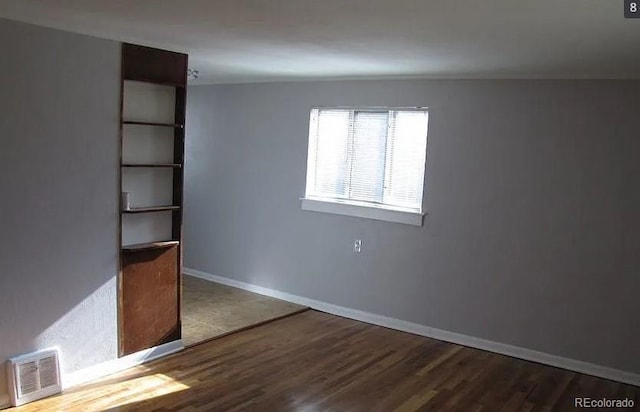 unfurnished bedroom featuring hardwood / wood-style flooring