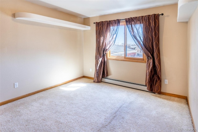 empty room with carpet floors, baseboards, and baseboard heating