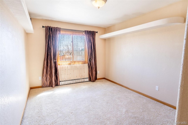 carpeted empty room featuring a baseboard radiator and baseboards