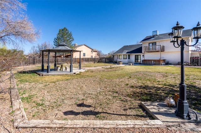 view of yard with a patio area, a fenced backyard, and a gazebo