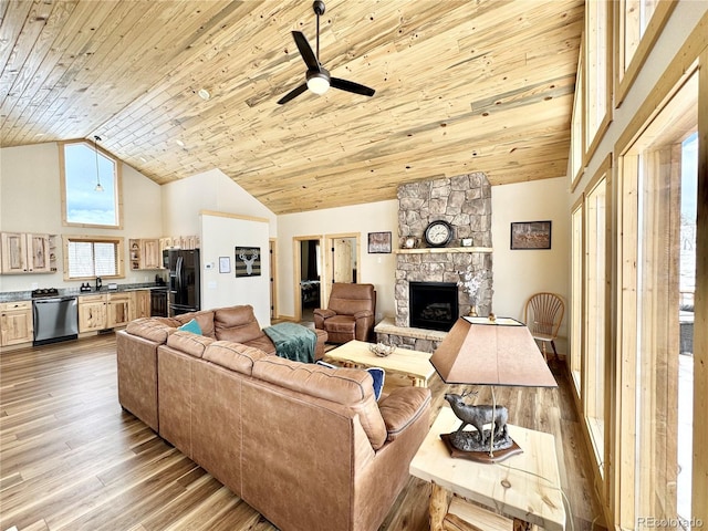 living area featuring high vaulted ceiling, a stone fireplace, wood finished floors, and wood ceiling