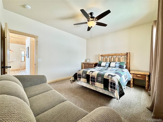 bedroom with carpet flooring, a ceiling fan, and baseboards