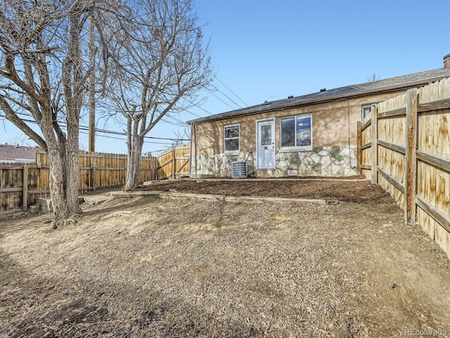 back of house with cooling unit