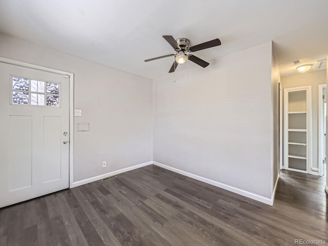 foyer featuring ceiling fan and dark hardwood / wood-style floors